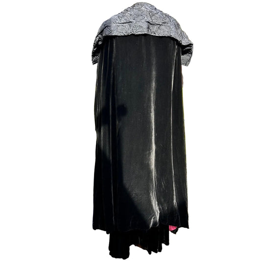 back view of full length Art Deco black velvet cocoon cape with feature collar on white background - Splendid Vintage World