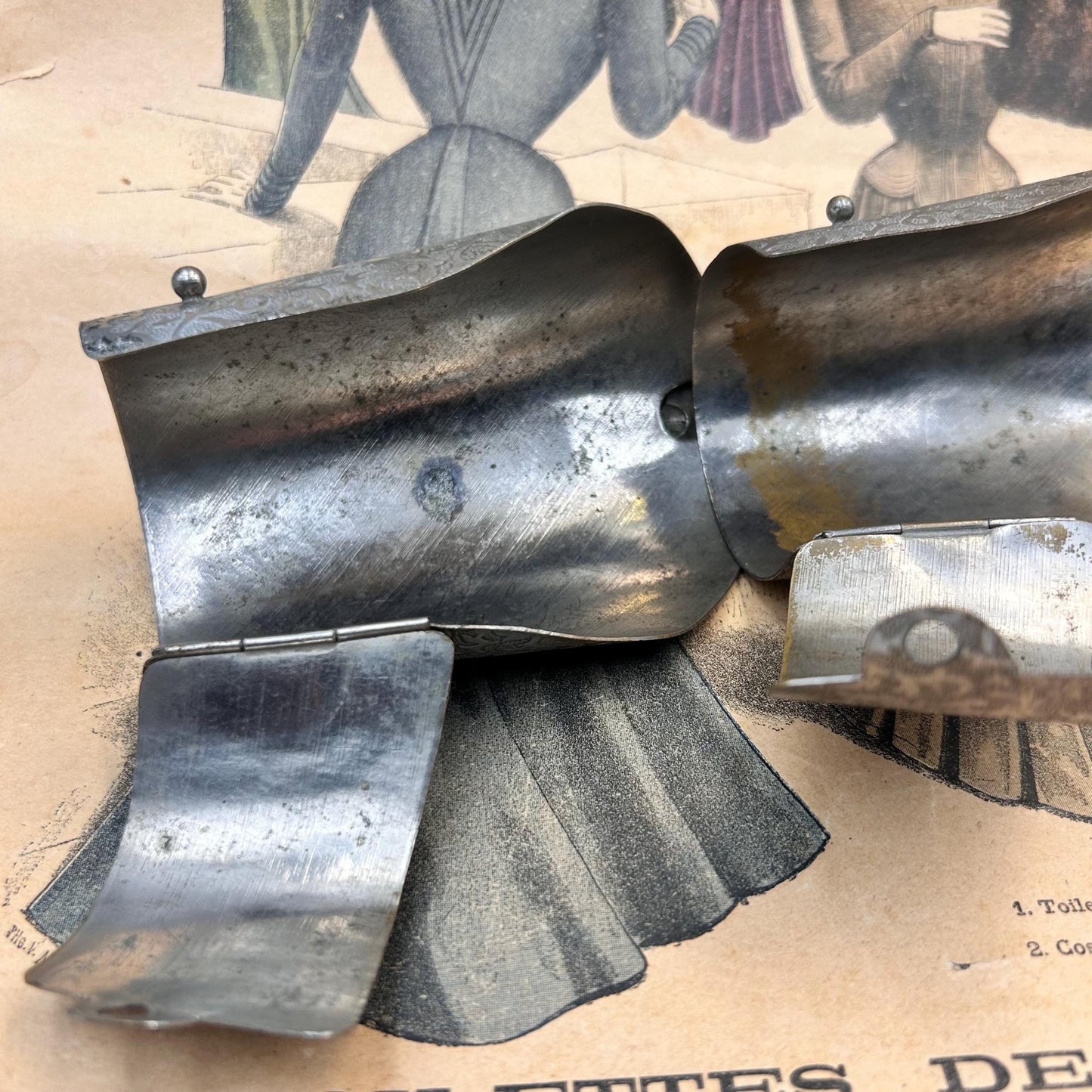 Pair of Vintage Art Deco style metal cuffs or bracelets with etched foliage pattern & applied metal & black glass detailing