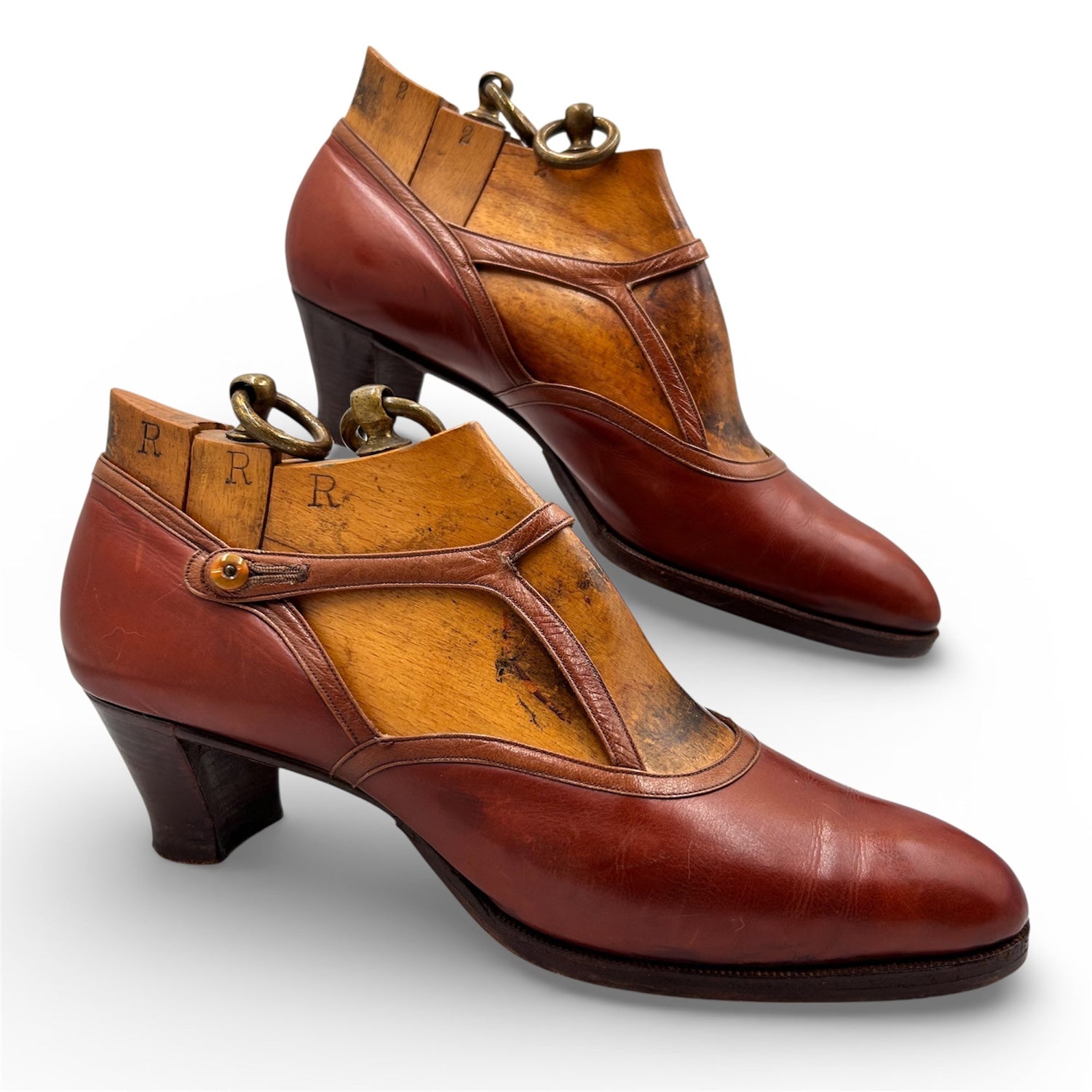 Antique brown leather Mary Jane Shoes with original wooden trees inside on a white background - Splendid Vintage World