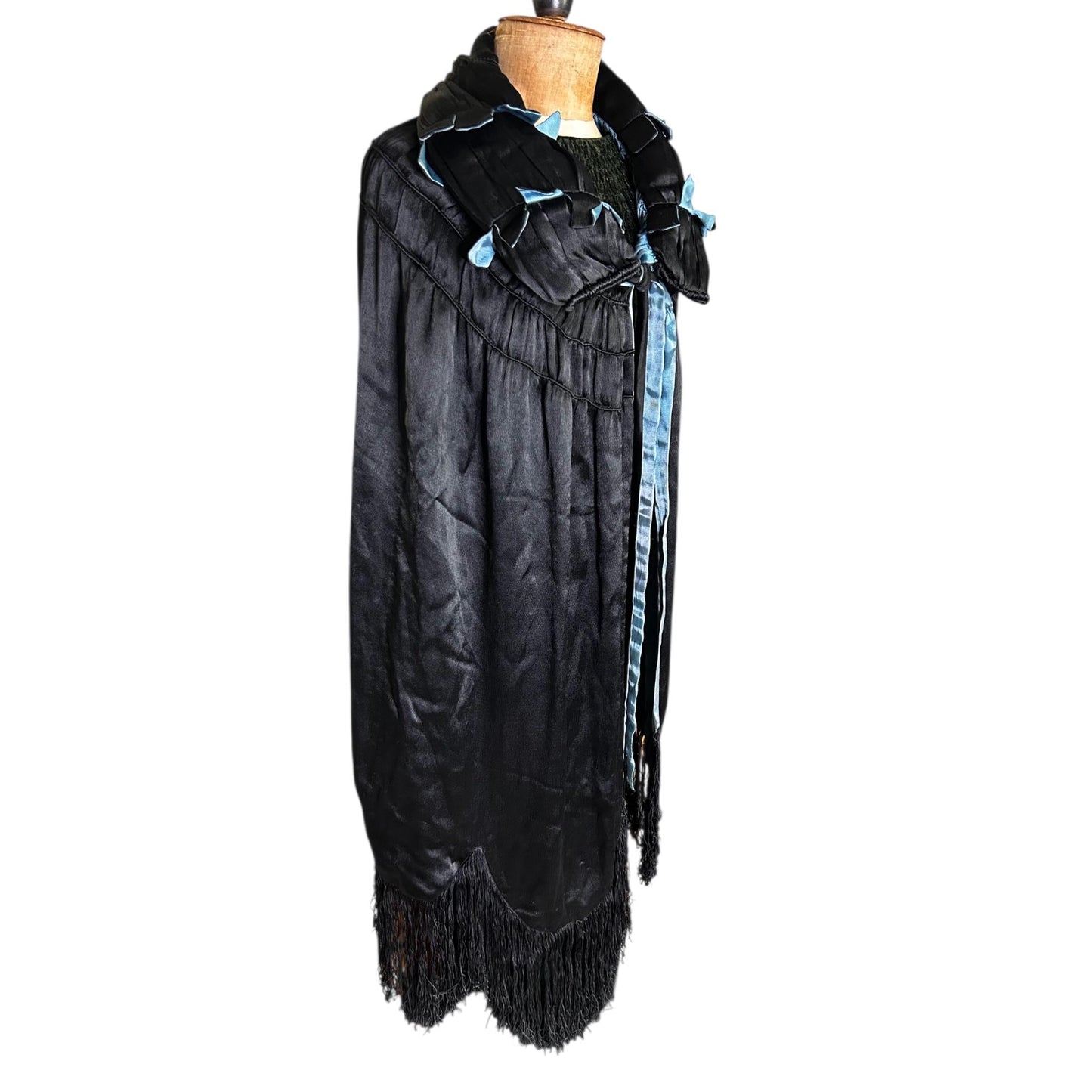 1920s 1930s Black & Blue cape with padded feature collar, silk fringe on mannequin on white backdrop - Splendid Vintage World
