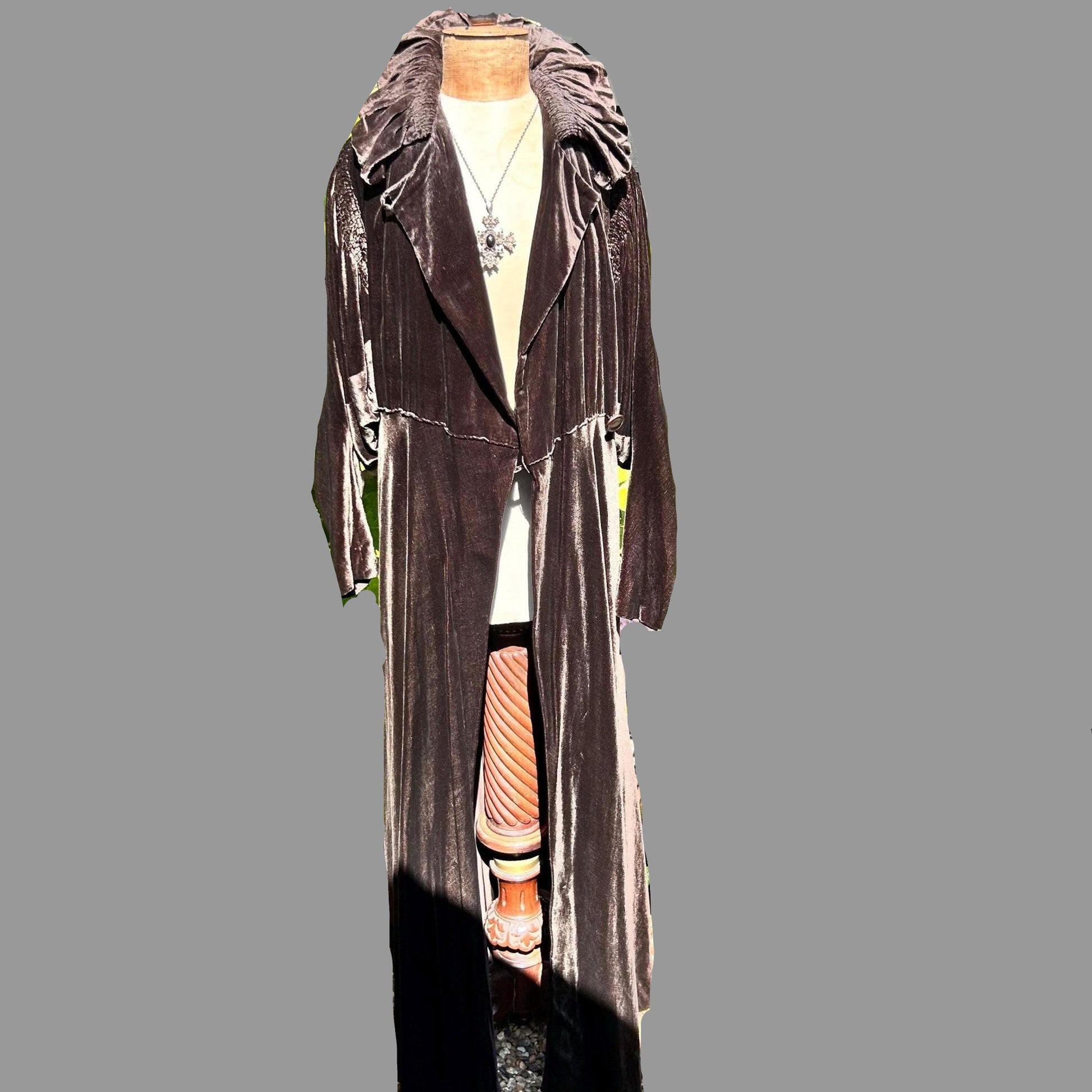 front view of a Dark Brown long Velvet Coat on a mannequin on a grey background - Splendid Vintage World