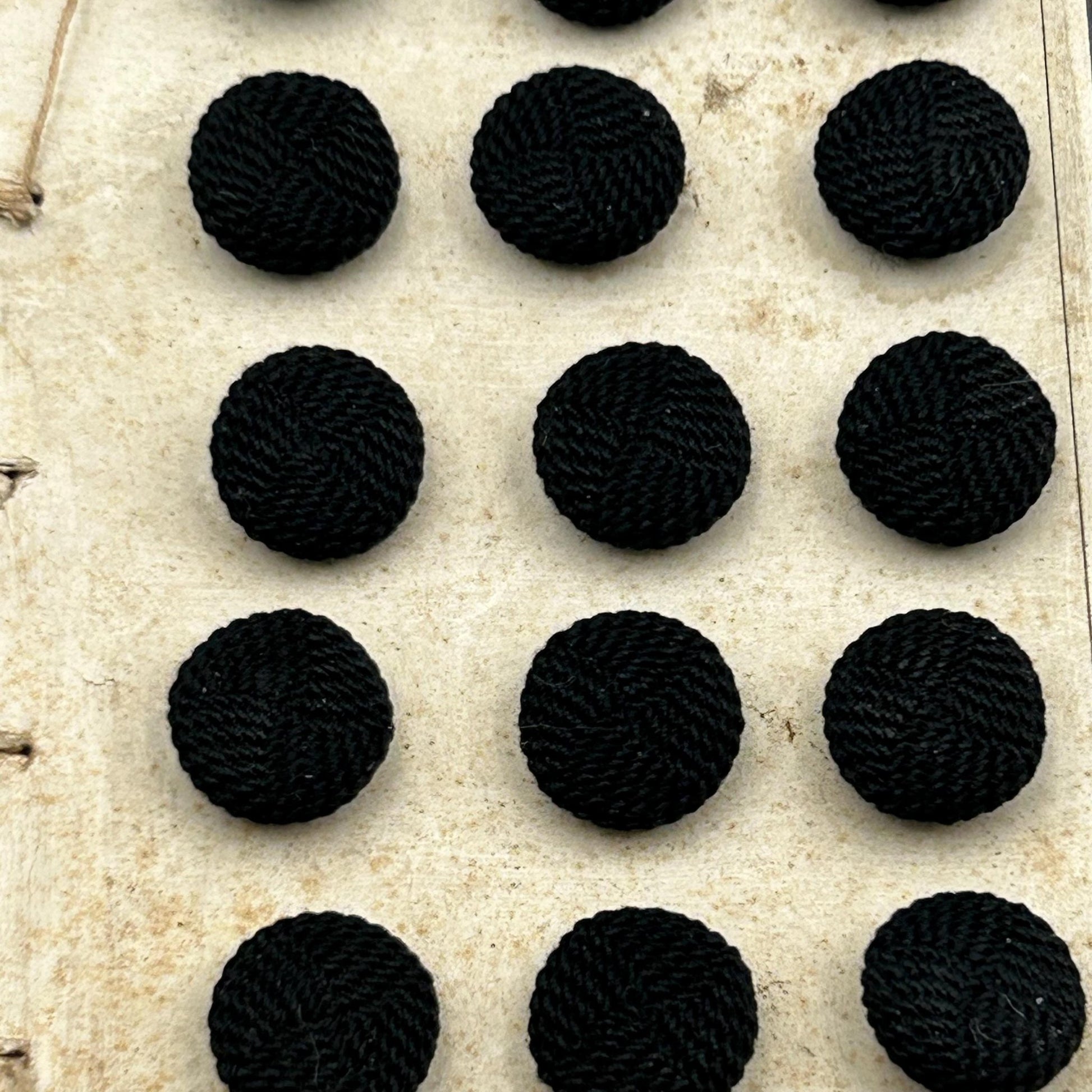 close up of 26 Antique French Black Textile Buttons 12mm, Metal Shanks on original card - Splendid Vintage World