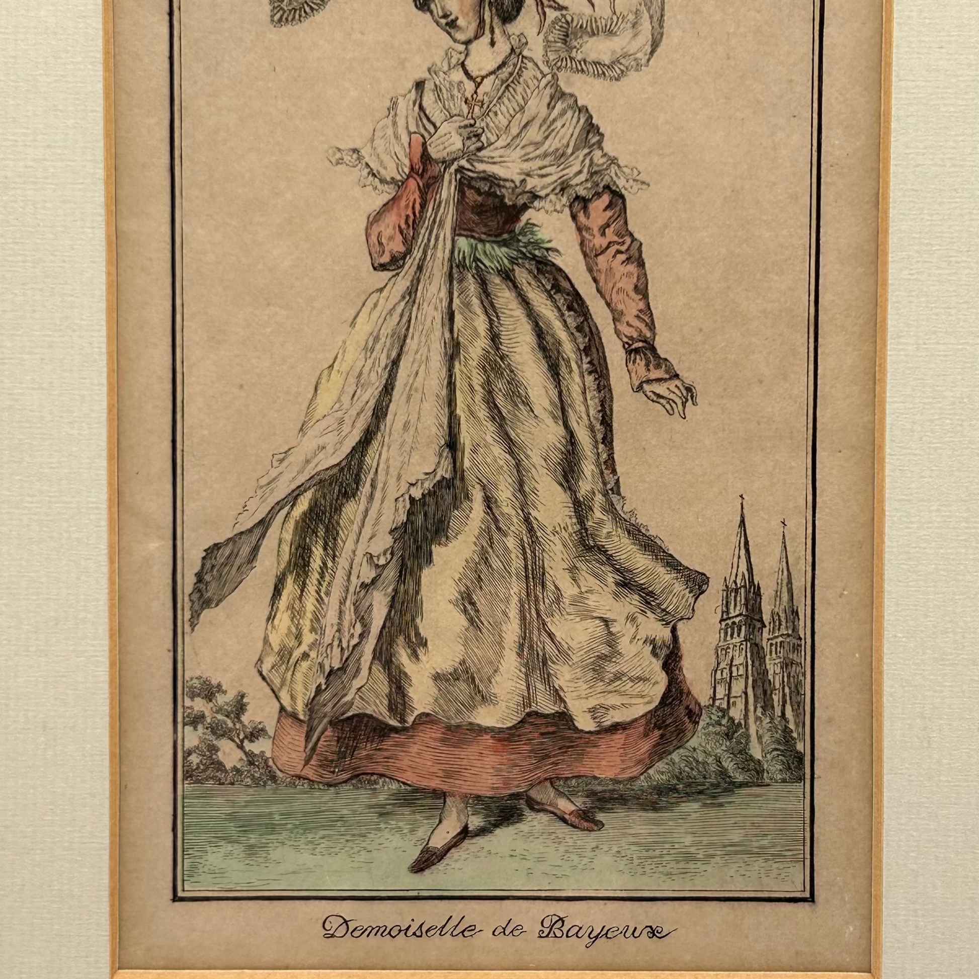 Antique print of a woman in French historical dress with 2 church spires in background - splendid vintage world