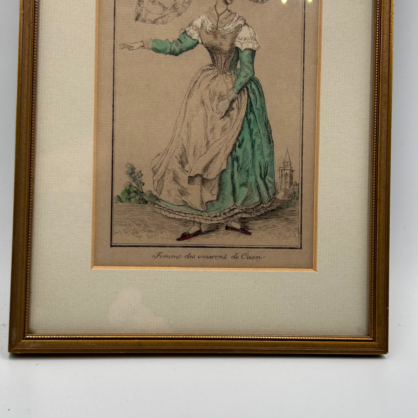 Framed print of a woman in normandy  historical dress on a beige background
