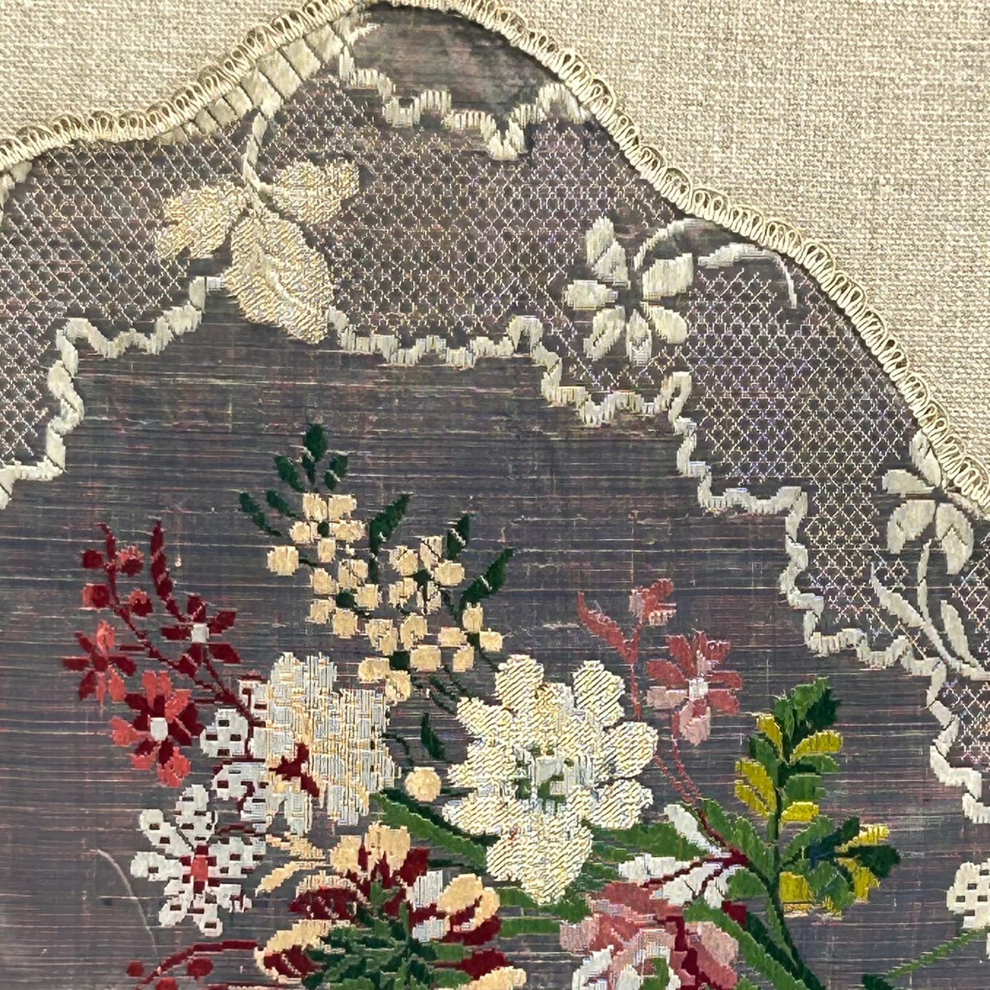 Floral embroidery on fabric with lace trim
