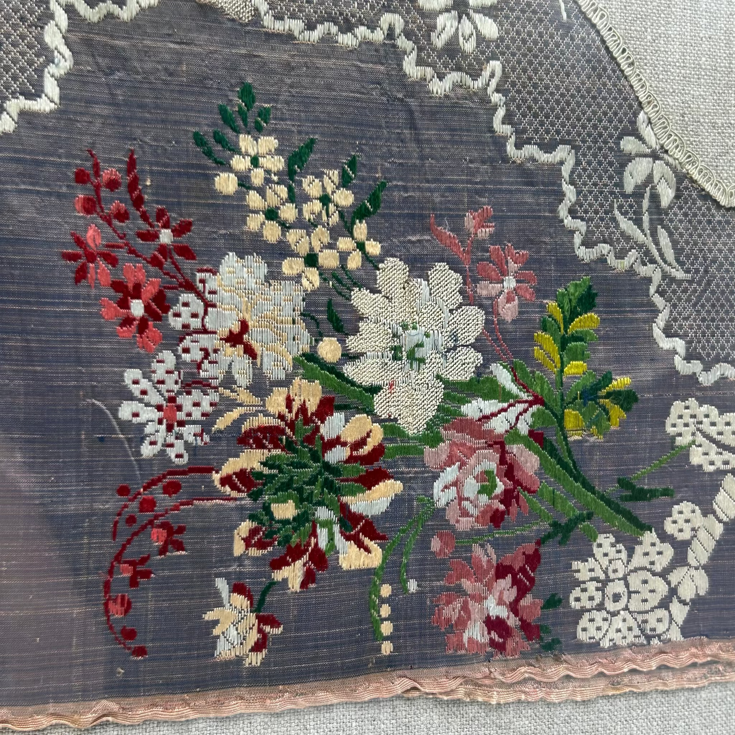 Floral embroidery on fabric with lace trim