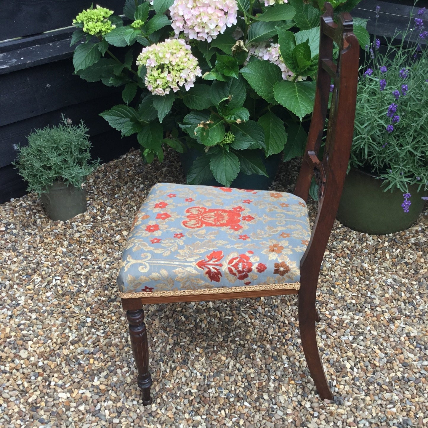 Side view Edwardian rosewood bedroom chairs which have been newly upholstered in Jim Dickens fabric