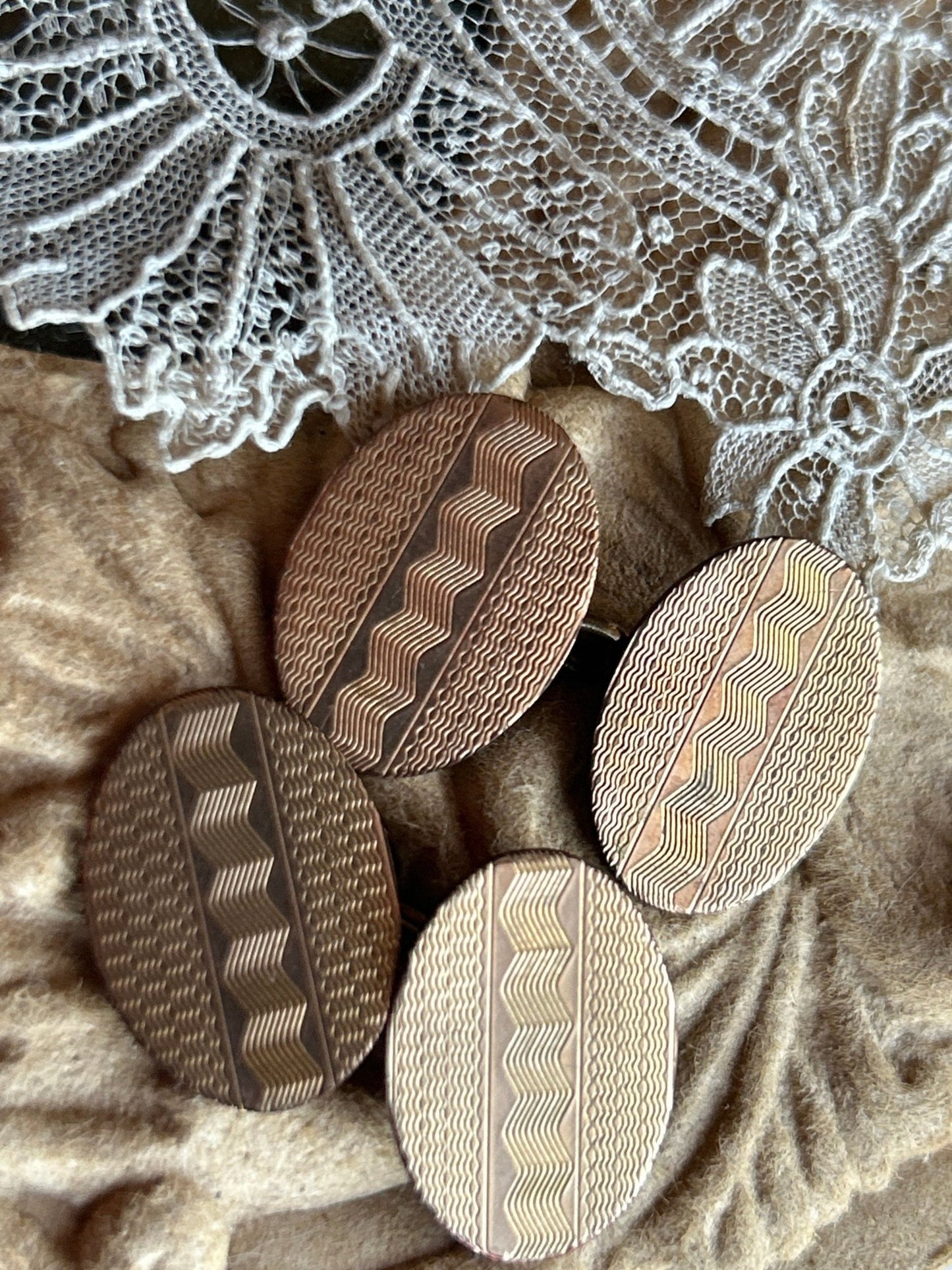 oval 10CT gold front cufflinks with engraved zig zag pattern against lace and light brown embossed - Splendid Vintage World