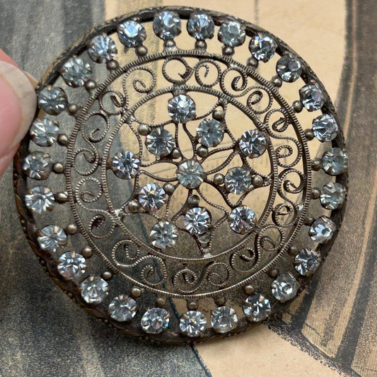 Edwardian diamanté hair decoration or dress adornment. Circular in shape & has 4 loops to the back for attachment
