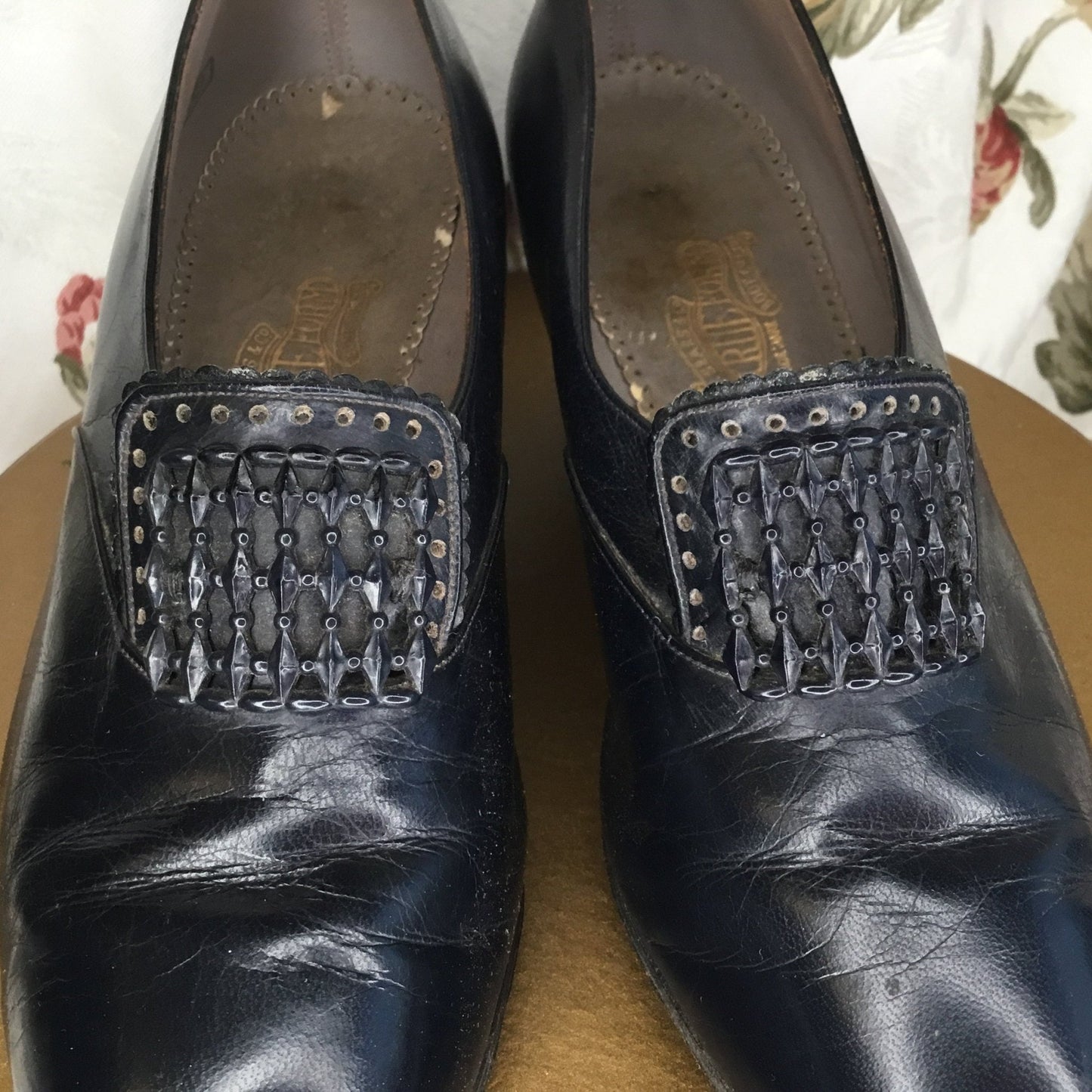 Dark Blue Leather Shoes Louis Heels,Buckle adornment close up against floral curtain background - Splendid Vintage World