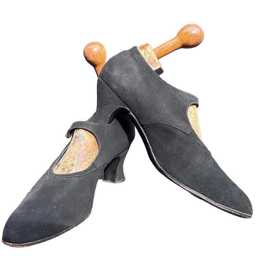 Antique 1920’s black suede shoes with wooden trees against a white background - Splendid Vintage World