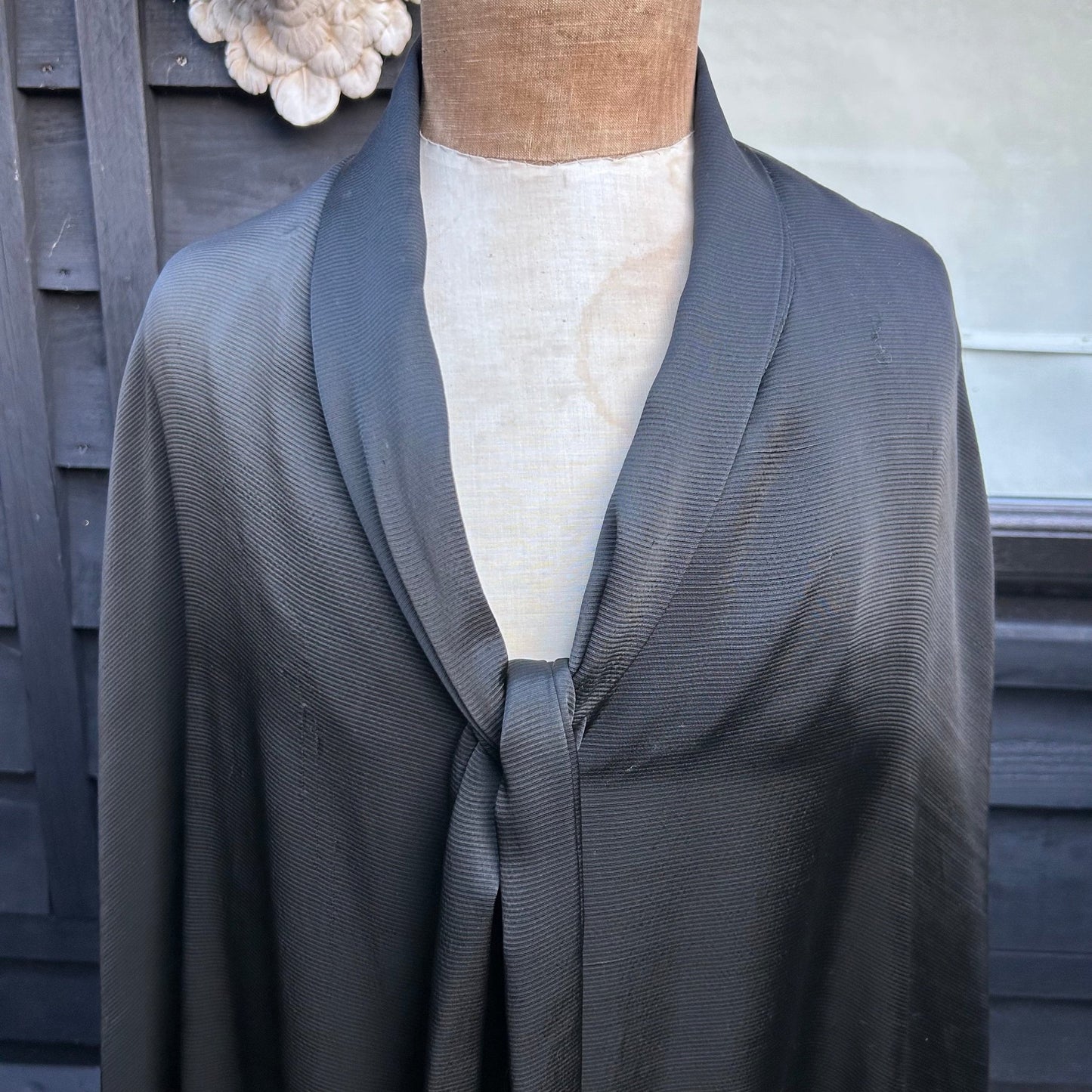close up of neckline of Antique black silk opera cape on a mannequin - Splendid Vintage World