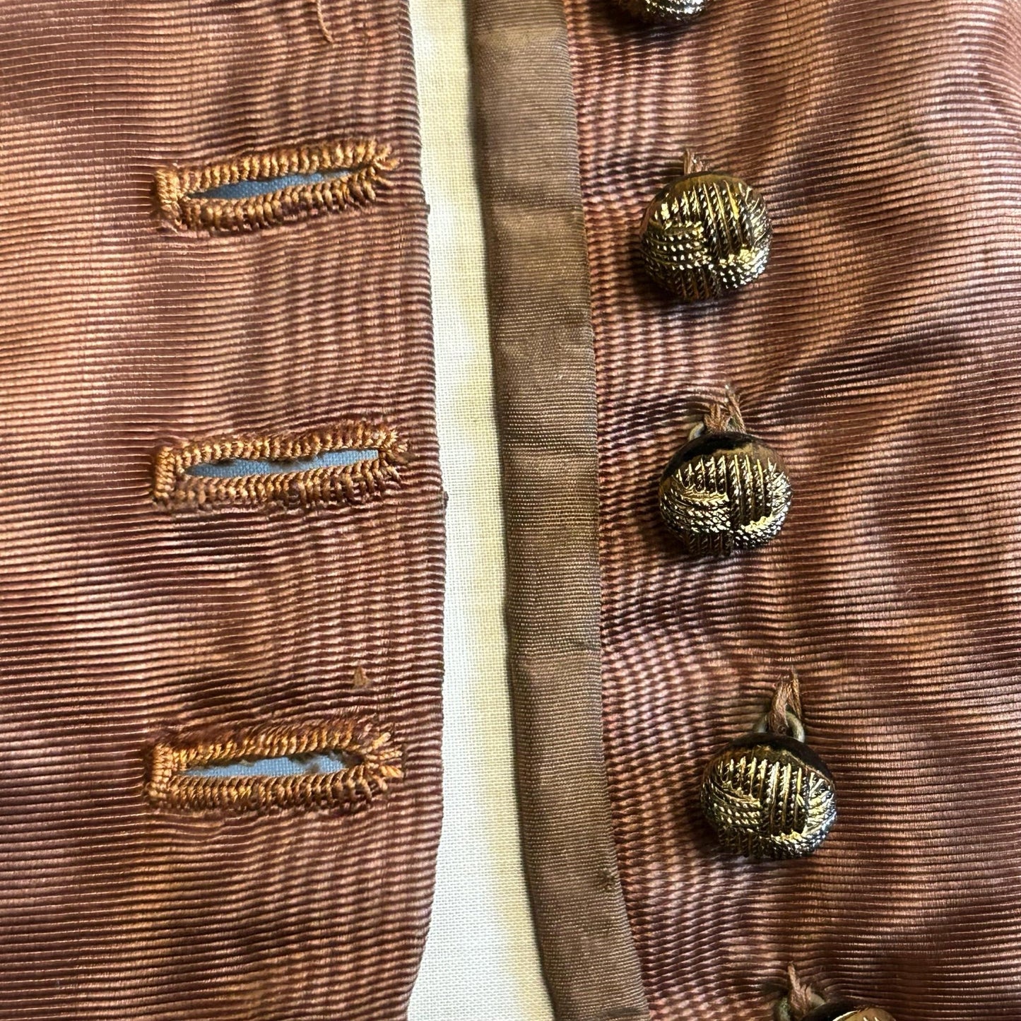 close up of open Antique bodice in brown copper moire silk, glass buttons & button holes - Splendid Vintage World