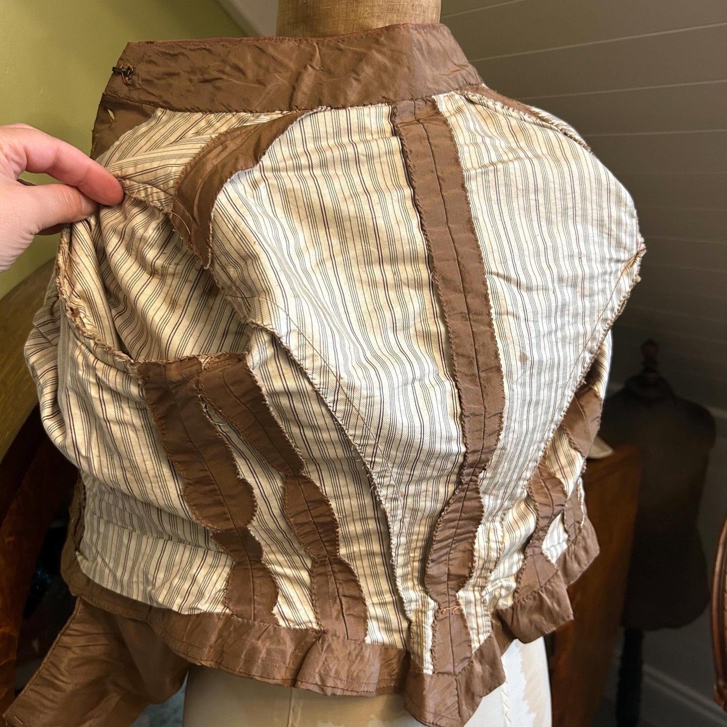 internal view of Antique bodice brown copper moire silk bodice in green room backdrop - Splendid Vintage World