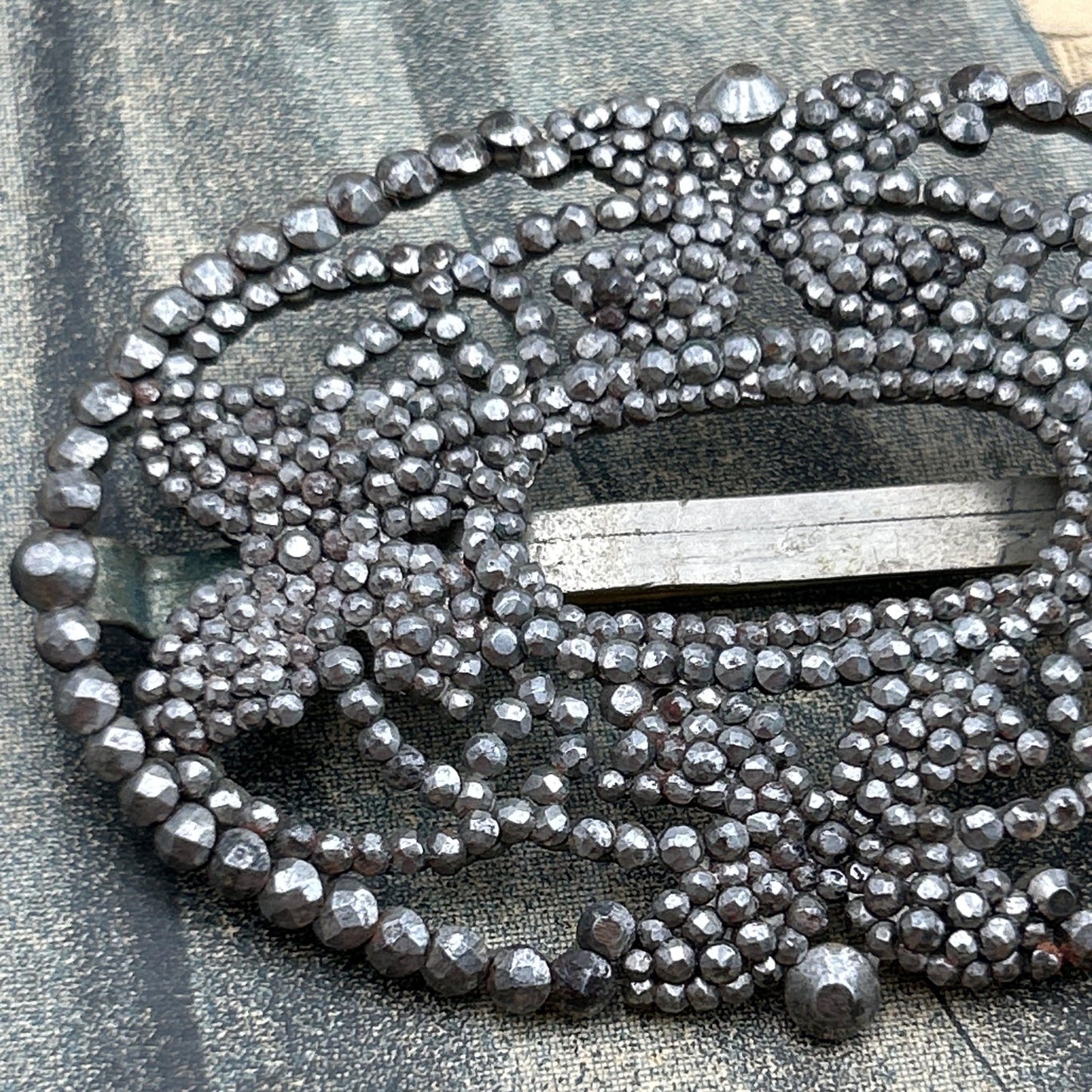 Antique butterfly brooch cut steel pinned construction close up on grey background - Splendid Vintage World