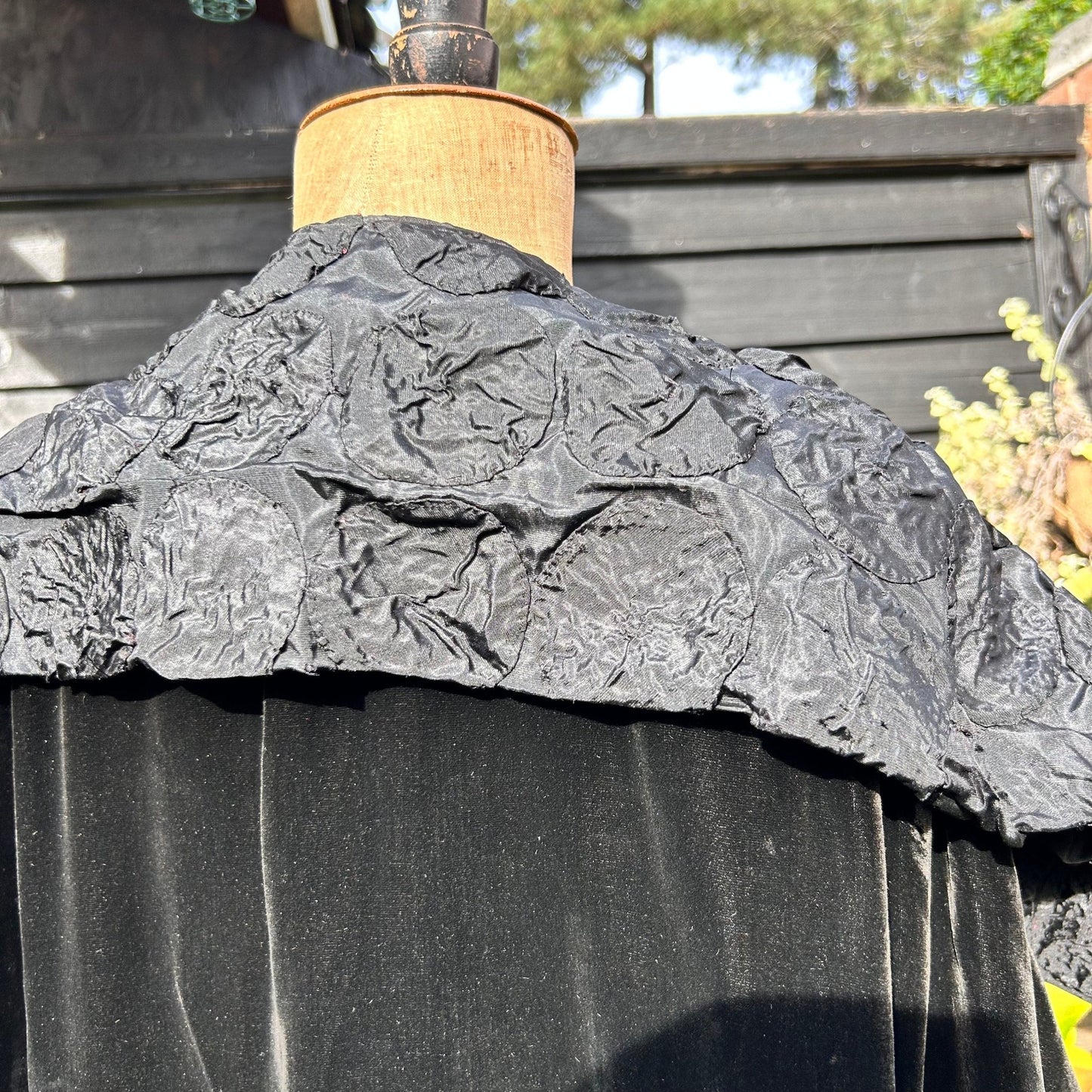 Art Deco black velvet cape silk feature collar on mannequin against black fence - Splendid Vintage World