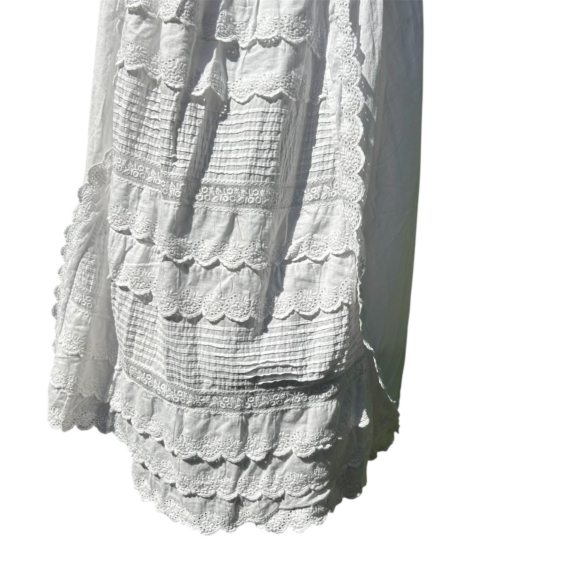 White Cotton Embroidered skirt of christening gown against white background - Splendid Vintage World