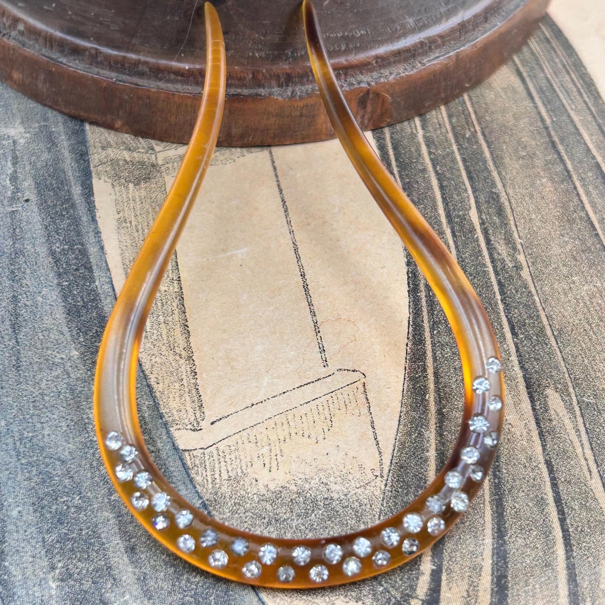 Antique hair comb in very good condition. faux tortoiseshell with clear paste stones All stones present , completely wearable