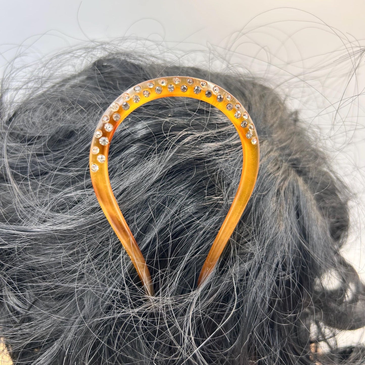Antique hair comb in very good condition. faux tortoiseshell with clear paste stones All stones present , completely wearable