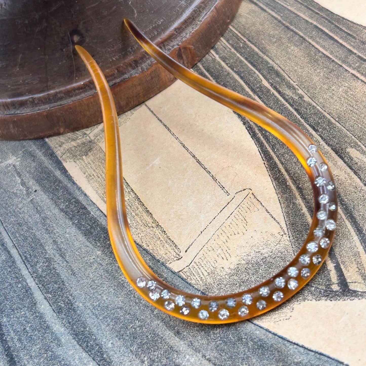 Antique hair comb in very good condition. faux tortoiseshell with clear paste stones All stones present , completely wearable