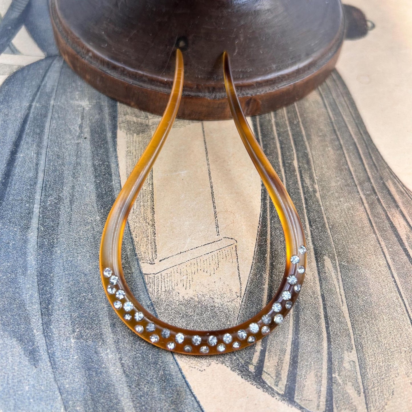 Antique hair comb in very good condition. faux tortoiseshell with clear paste stones All stones present , completely wearable