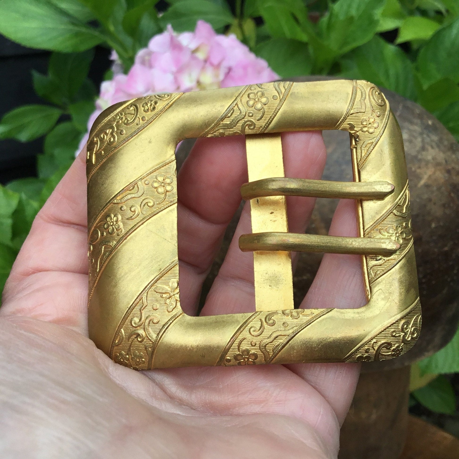 Antique Edwardian gilt metal buckle With floral & butterfly detail in between plain diagonal bands - Splendid Vintage World