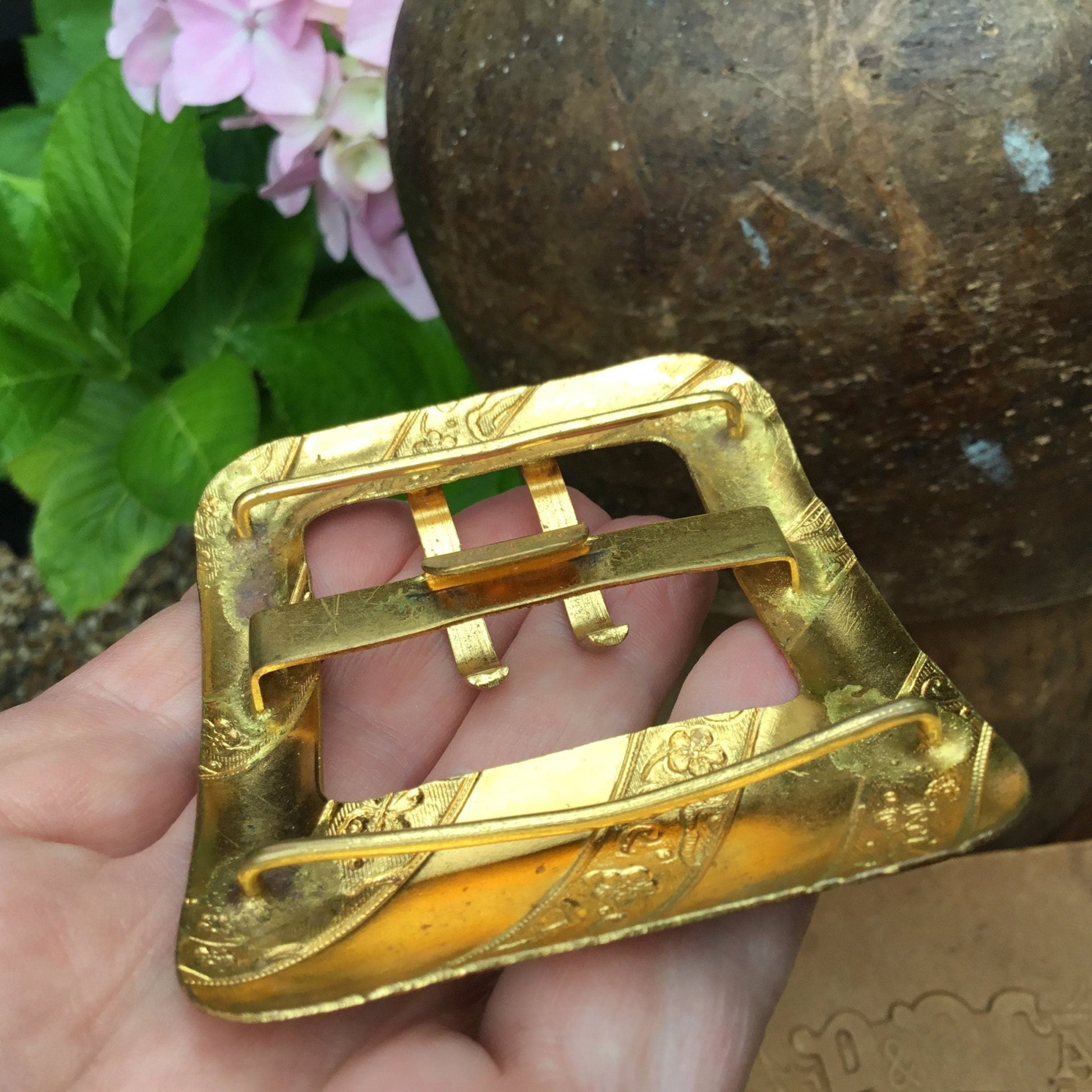 Antique Edwardian gilt metal buckle With floral & butterfly detail in between plain diagonal bands - Splendid Vintage World