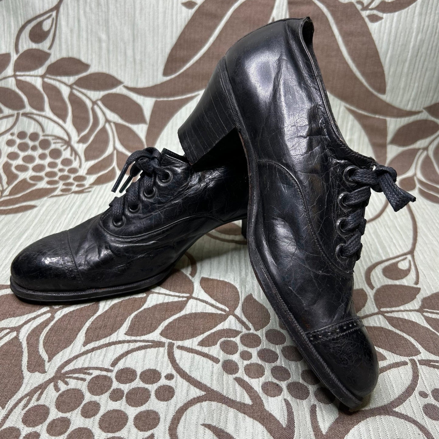 Antique Edwardian Ladies black leather lace up Oxford heeled shoes on patterned background - Splendid Vintage World