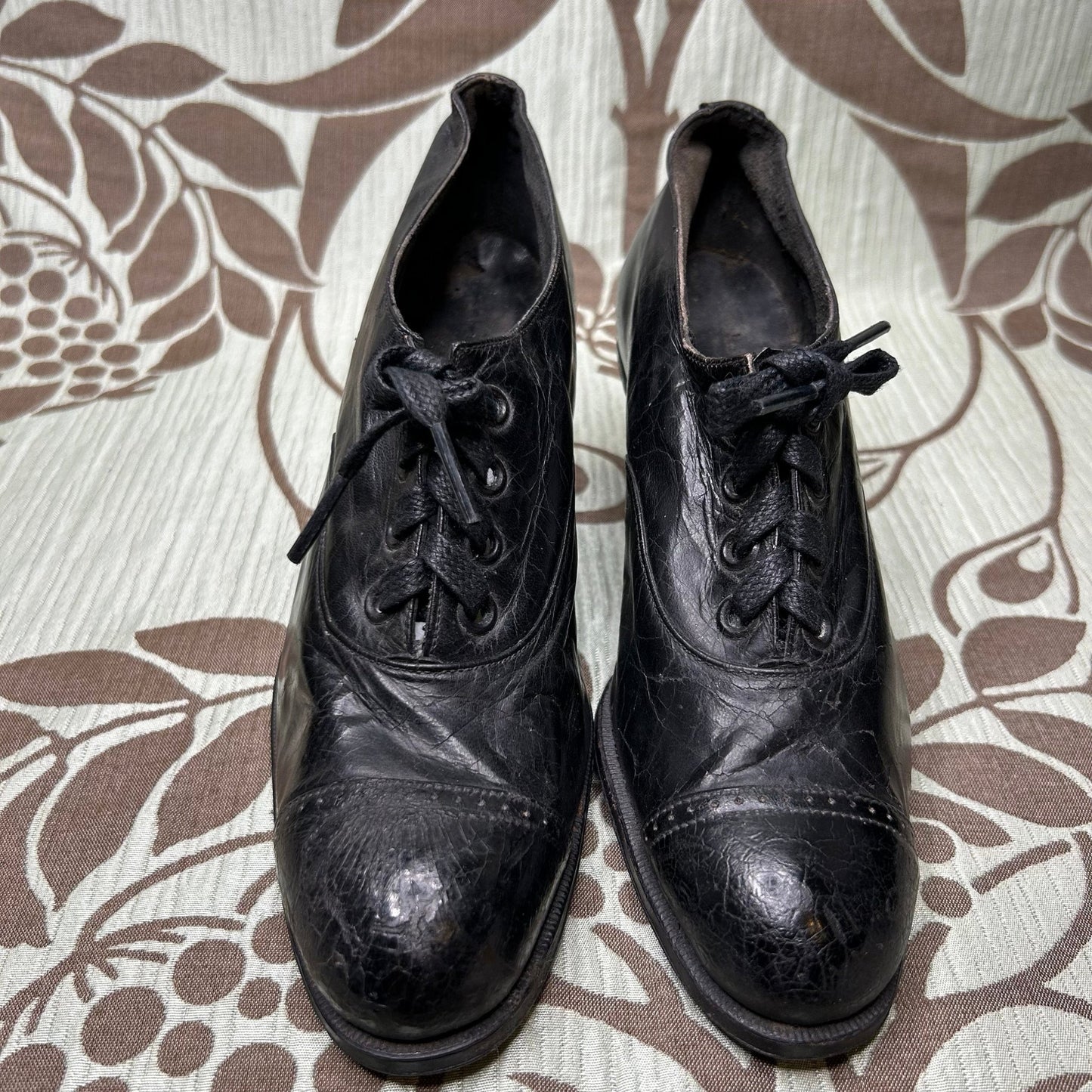 Antique Edwardian Ladies black leather lace up Oxford heeled shoes on patterned background - Splendid Vintage World