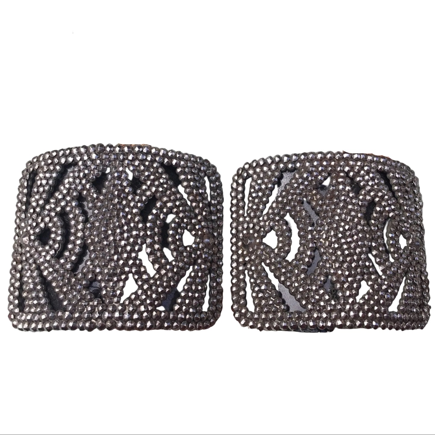 Antique French Cut Steel Shoe Buckles with geometric design against white background - splendid vintage world