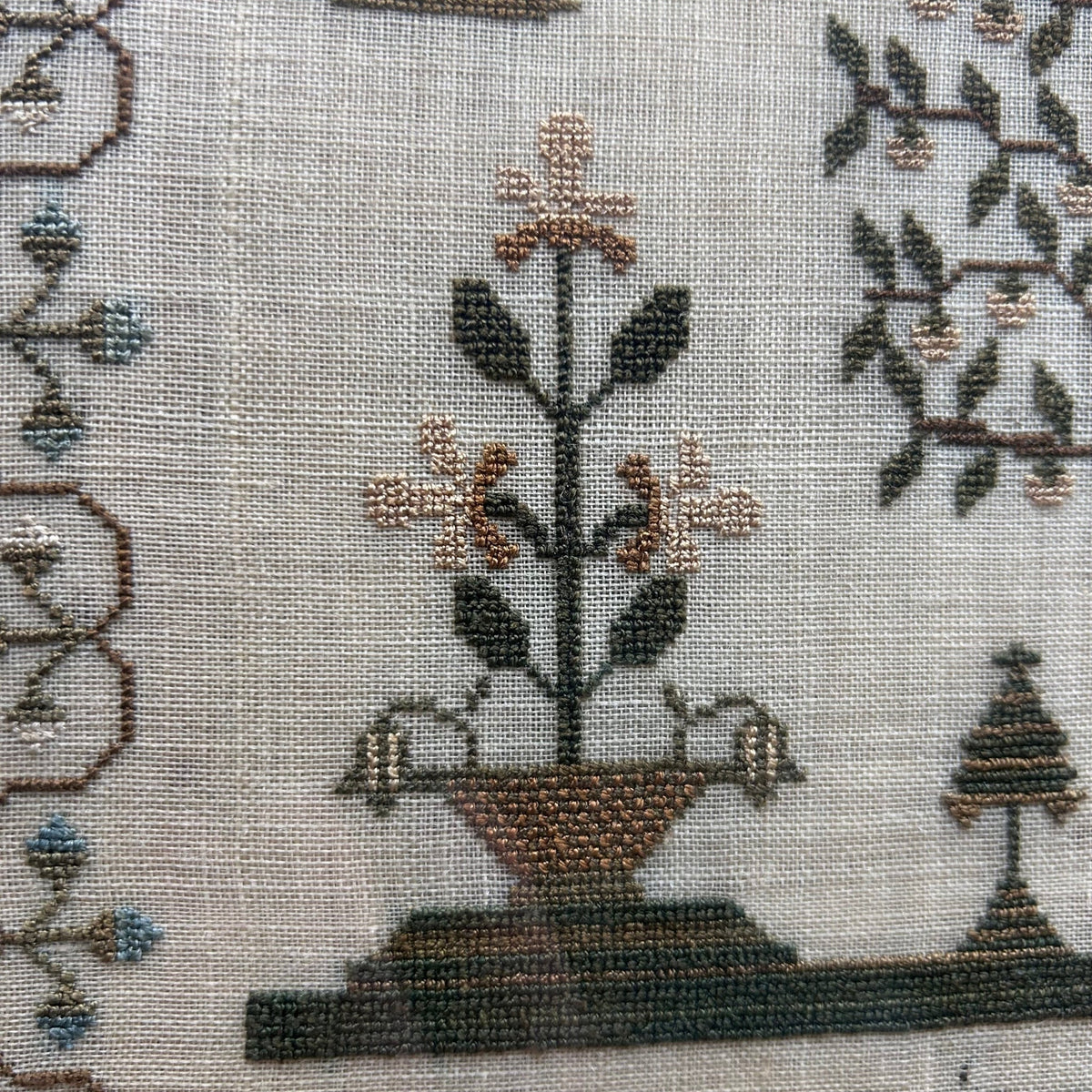 finely embroidered sampler with floral borders verse trees & various flowering plants - Splendid Vintage World