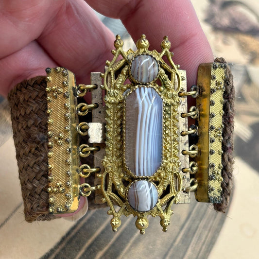 Antique Georgian Woven Hair Cuff Bracelet Gilt Metal & Agates held by hand on printed background - Splendid Vintage World