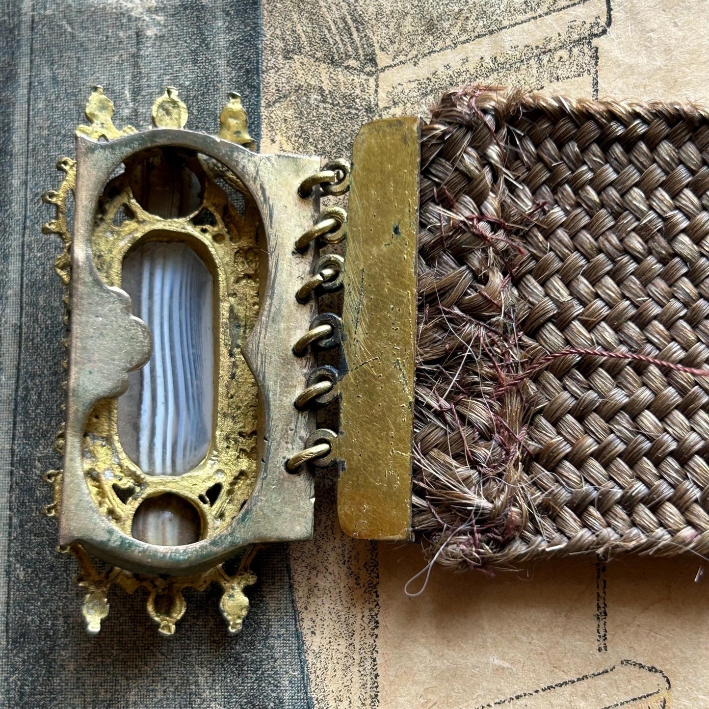 Antique Georgian Woven Hair Cuff Bracelet Gilt Metal & Agate fastening back view on printed paper - Splendid Vintage World