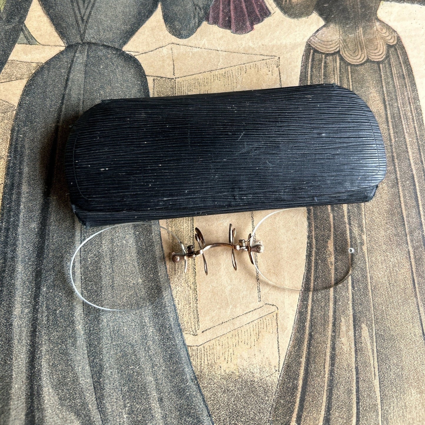 Pince Nez Spectacles on colour printed fashion paper next to spectacle Case - Splendid Vintage World