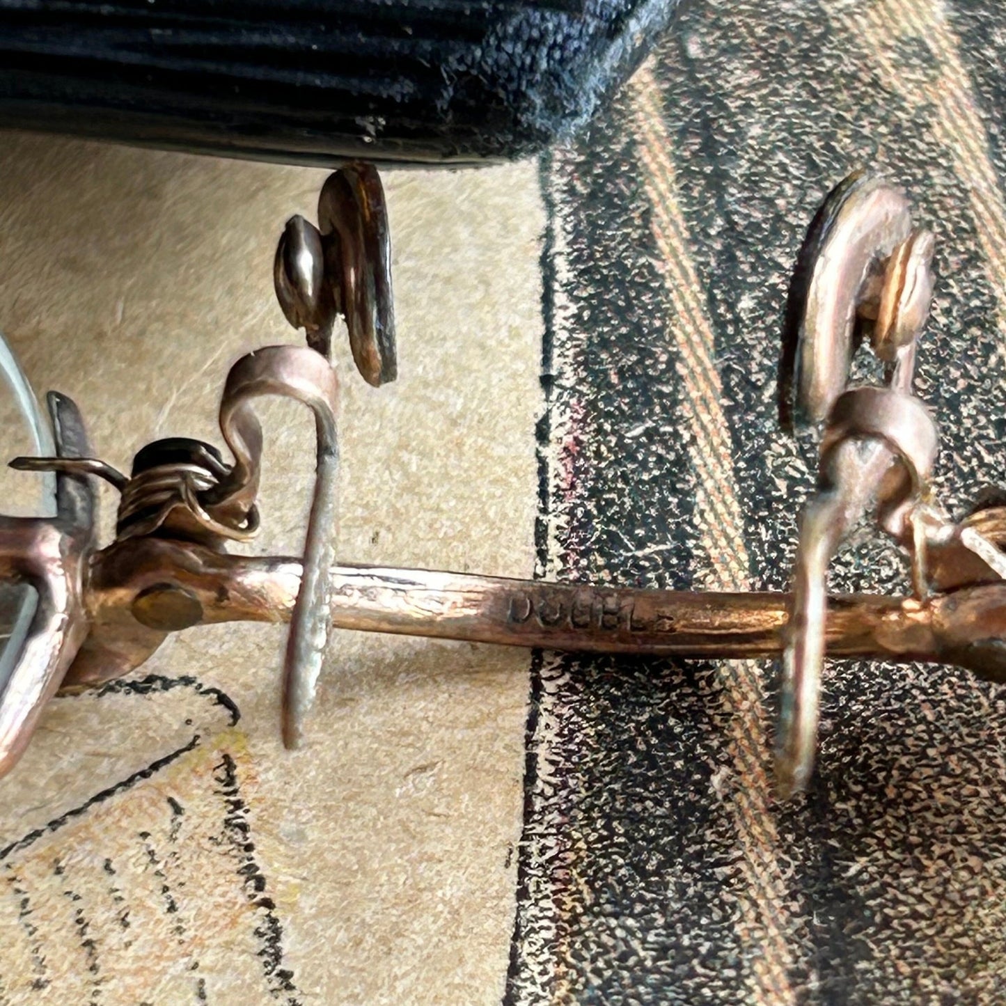 Pince Nez Spectacles bridge close up on printed paper - Splendid Vintage World