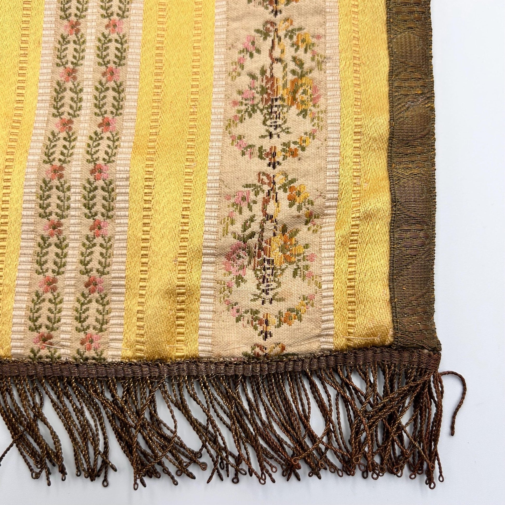 Antique Silk Brocade Bag with Metallic Fringe and metallic trimmings close up on light background - Splendid Vintage World