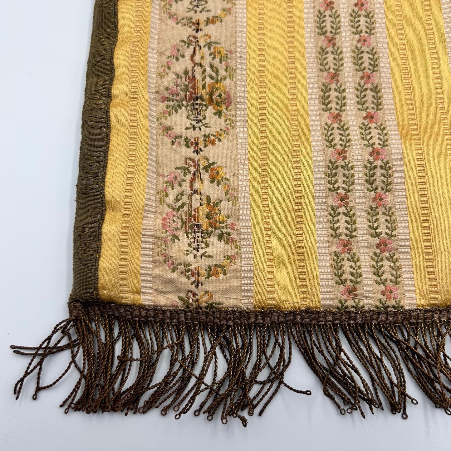 Antique Silk Brocade Bag with Metallic Fringe and trimmings, close up on light background - Splendid Vintage World