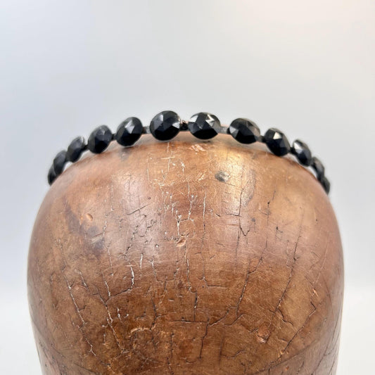 Antique Victorian black glass mourning tiara, hair jewellery of faceted black glass rounds on a black flexible metal band