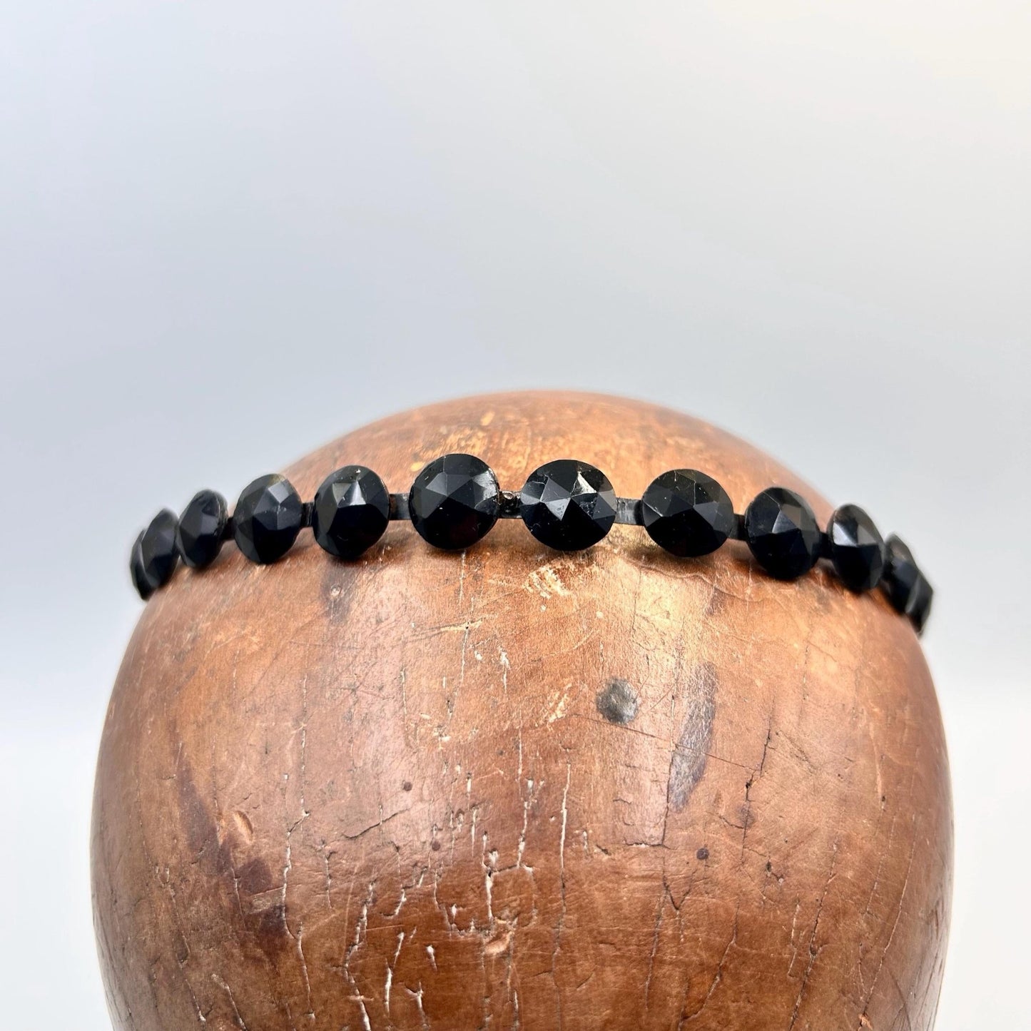 Antique Victorian black glass mourning tiara, hair jewellery of faceted black glass rounds on a black flexible metal band
