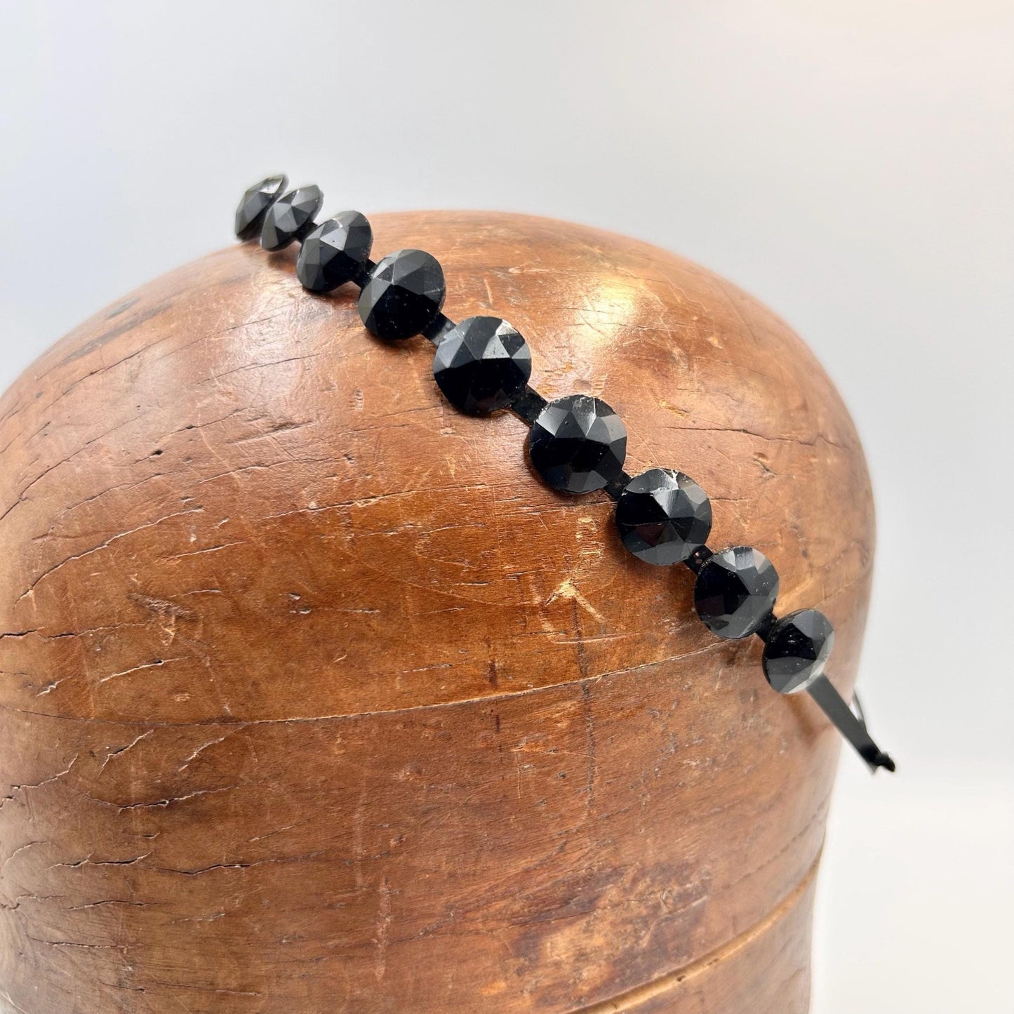 Antique Victorian black glass mourning tiara, hair jewellery of faceted black glass rounds on a black flexible metal band