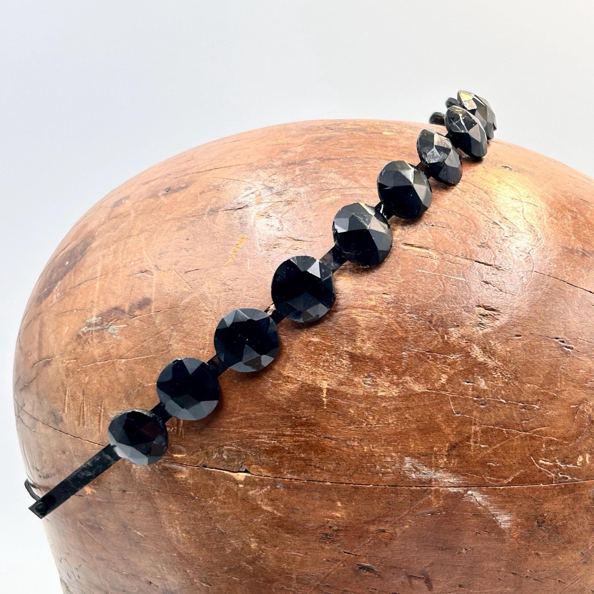 Antique Victorian black glass mourning tiara, hair jewellery of faceted black glass rounds on a black flexible metal band