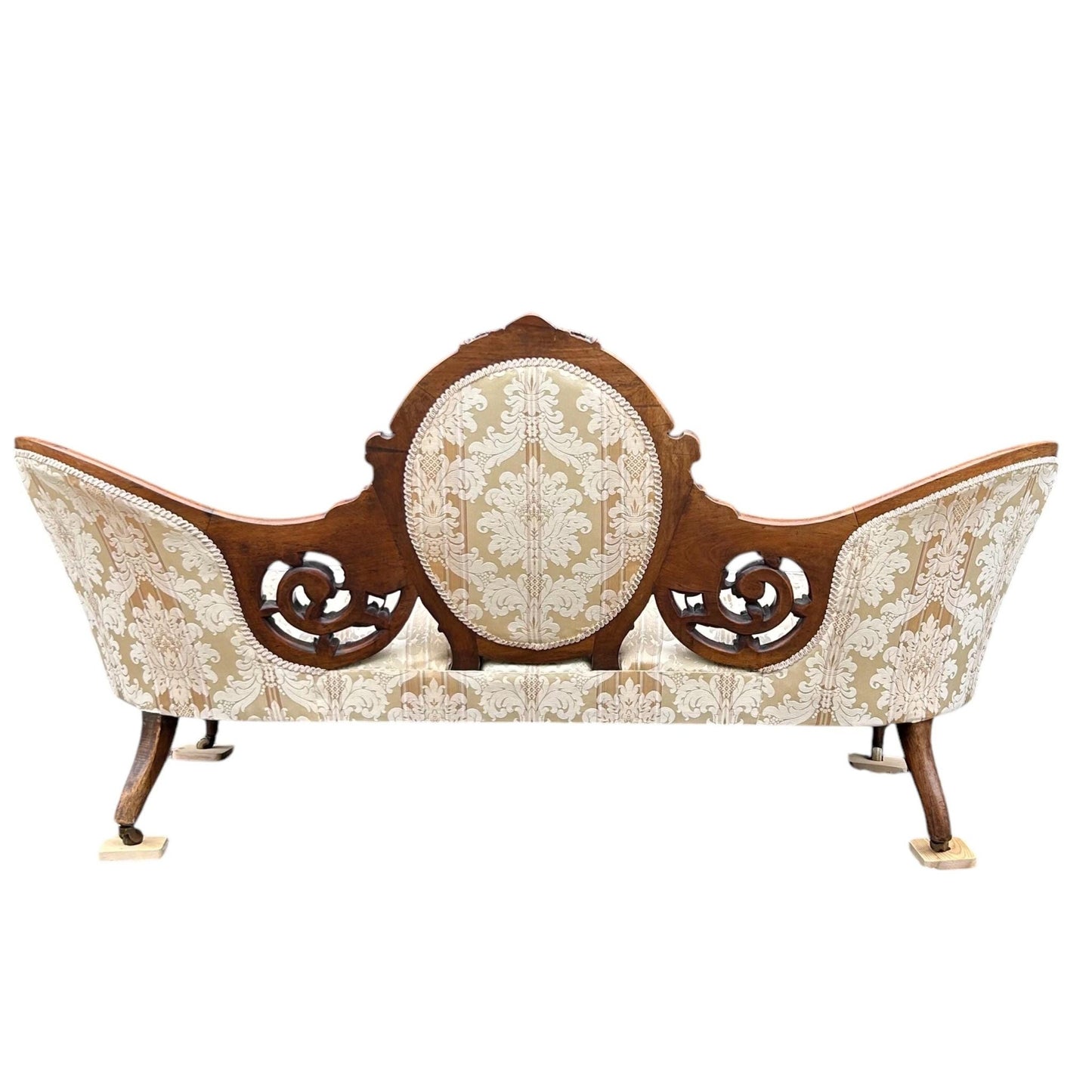 Back view of Victorian carved walnut cameo back sofa chaise on castors upholstered in beautiful traditional damask