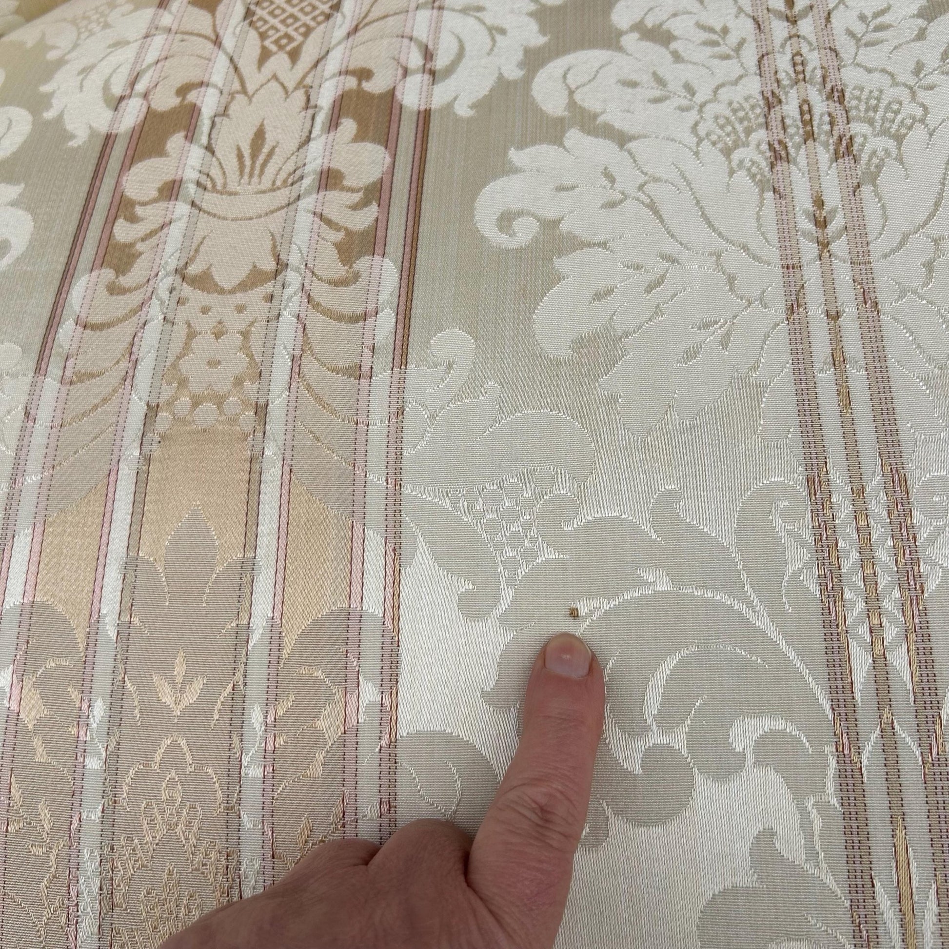 detail of very small mark on fabric