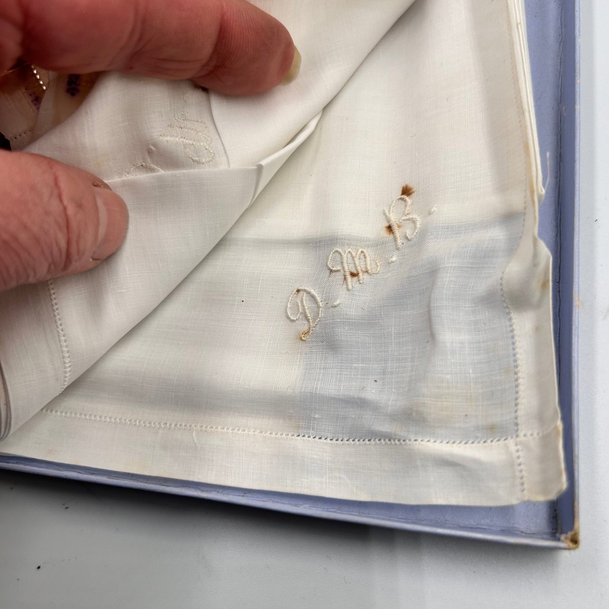 Antique Walpole brothers Linen handkerchiefs held by hand - Splendid Vintage World