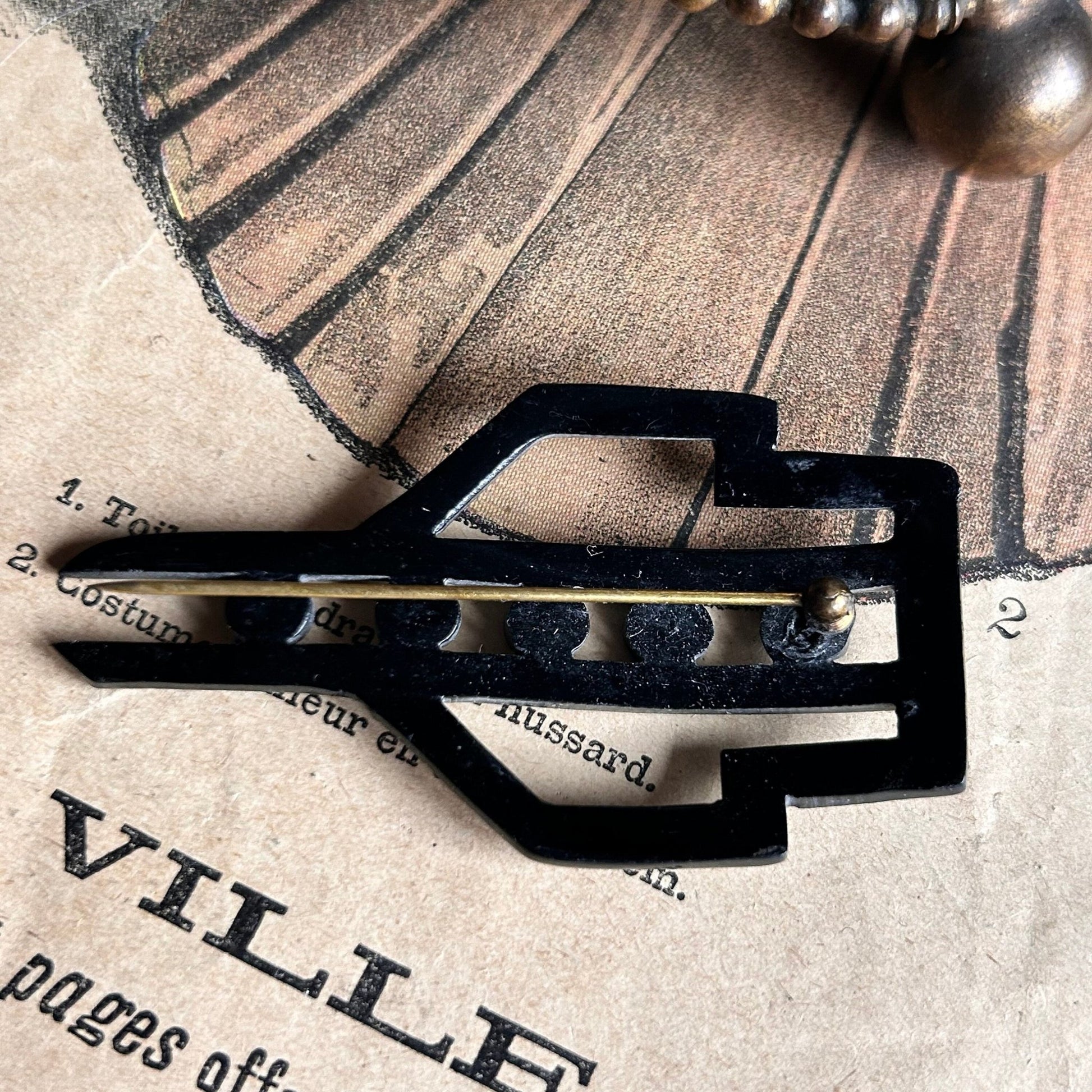 back of Art Deco Diamante Hat Pin on illustrated magazine background - Splendid Vintage World