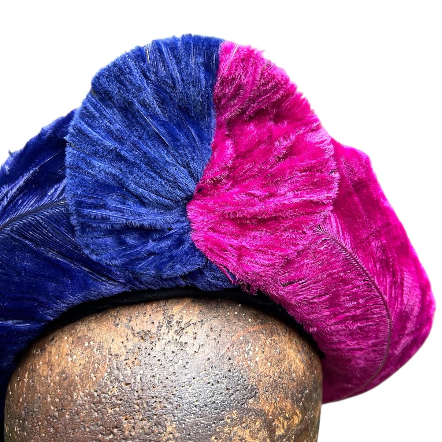 vibrant blue and pink ostrich feather hat on brown wooden hat block on white background - Splendid Vintage World