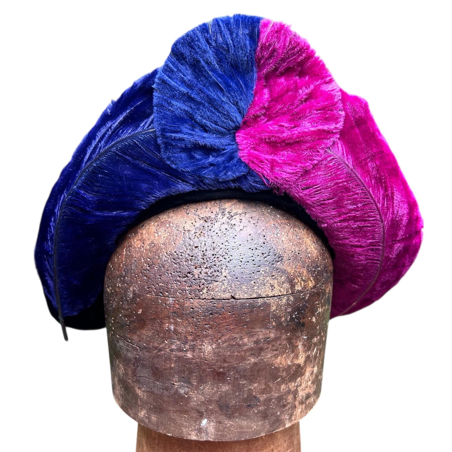 vibrant blue and pink ostrich feather hat on brown wooden hat block on white background- Splendid Vintage World