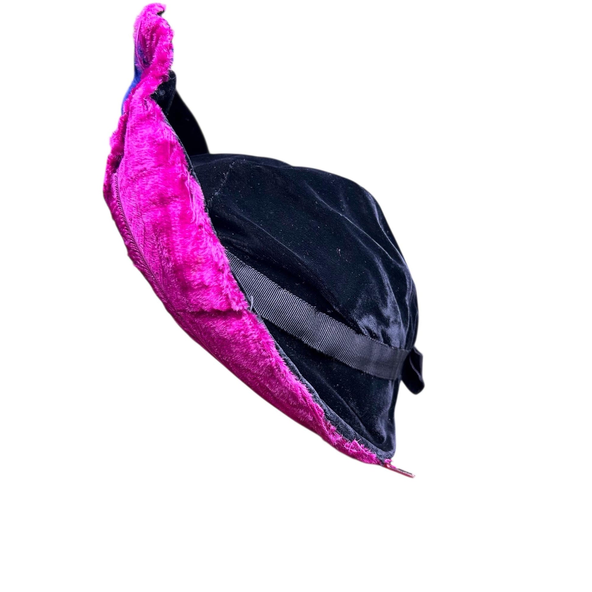 side view of fuchsia pink ostrich feather upright brim & black velvet hat crown on white background - Splendid Vintage World