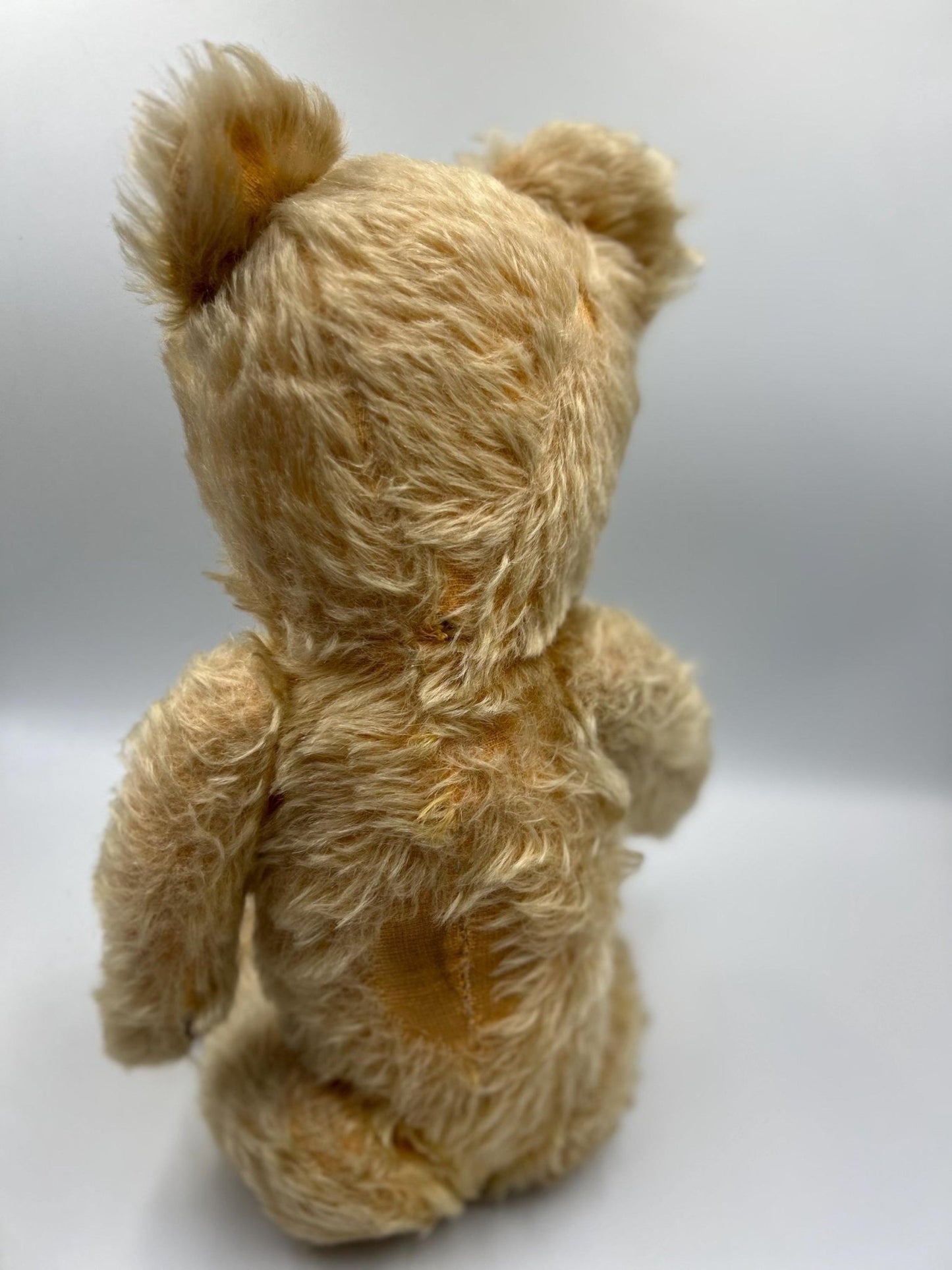 Vintage teddy bear jointed care worn on light grey background - Splendid Vintage World