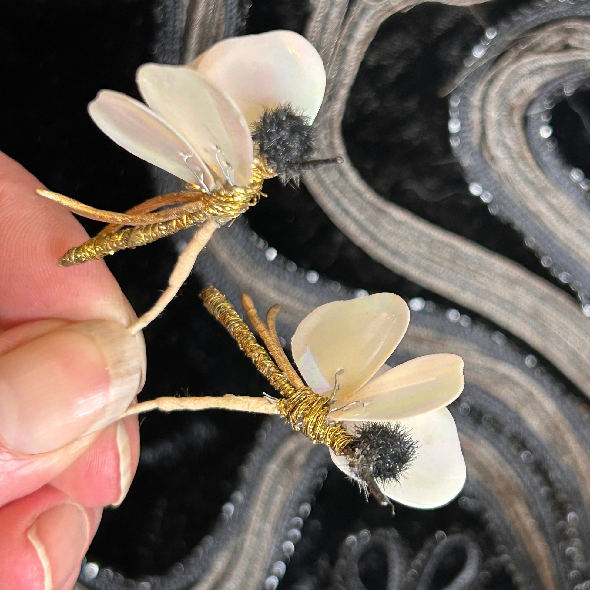 Vintage 1920s millinery insect hat adornments black chenille with iridescent wings x2 black backdrop- Splendid Vintage World